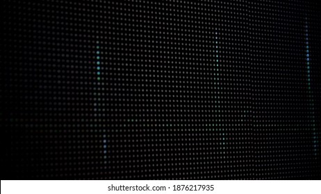 Device Screen With Pixels Fluctuate With Color And Motion. Media. Close Up Of Black Digital Monitor With Three Blue Blurred Vertical Shimmering Lines Forming The Human Pulse.