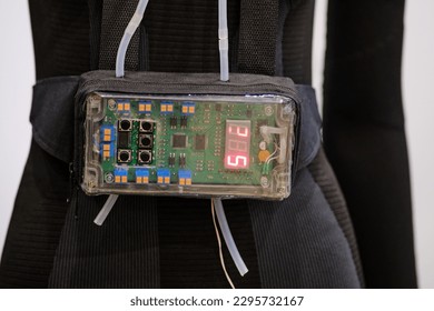 A device with a timer on a digital display attached to the mannequin's belt