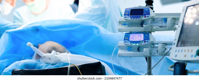 Devices For Monitoring The Vital Functions Of The Patient's Body Lying On The Operating Table. Selective Focus. High-tech Medical Equipment. Indicators Of The State Of The Body During Surgery.