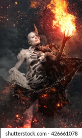 Devil Woman With Horn In A Fire.