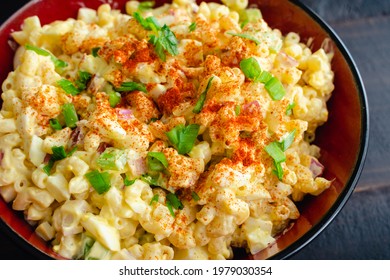 Deviled Egg Pasta Salad In A Serving Bowl: A Large Bowl Of Macaroni Salad Made With Hard-boiled Eggs