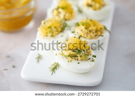 Deviled eggs with caviar and dill
