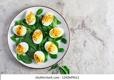 Deviled Eggs With Paprika As An Appetizer, Top View, Copy Space