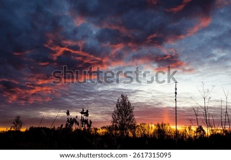 Devilish clouds at dawn. red clouds. at sunset. a natural phenomenon. landscape. screen saver