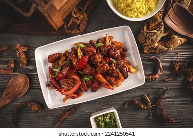 Devilled chilli chicken stir fry, spicy dish - Shutterstock ID 2241250541