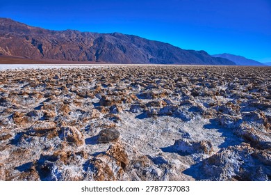 Devil's Golf Course Salt Formations and Distant Mountains in Sunlit Death Valley