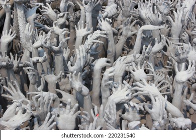 Devil's Hands from Hell, one of many beautiful decorations in Rongkhun Temple or White Temple in Chiangrai, Thailand