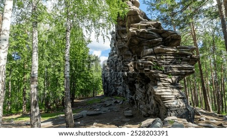 Devil's Hillfort complex on sunny summer day. Iset Park, Iset village, Sverdlovsk region, Russia. Hiking and walking.