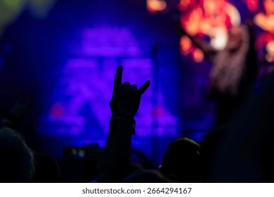 Devil's horn gesture in rock concert