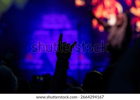 Devil's horn gesture in rock concert