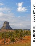 The Devils Tower over the forest