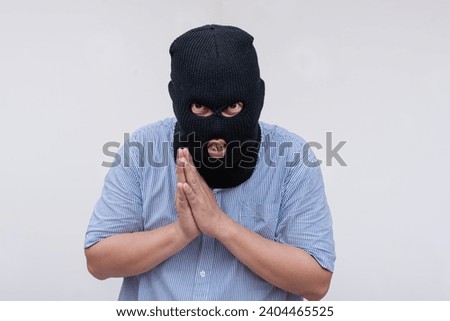 A devious evil man explains his masterplan while rubbing his hands, savoring his plan. Isolated on a white backdrop.