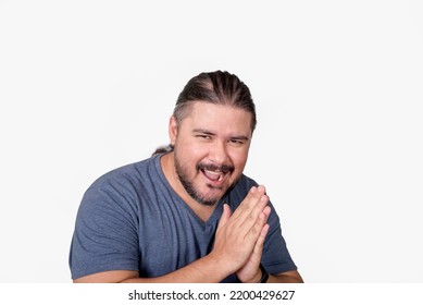 A devious man rubs his palms together seeing his master plan coming into fruition. A schemer and mastermind cackling. Isolated on a white background. - Shutterstock ID 2200429627
