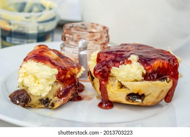 DEVON, ENGLAND- 25 June 2021: Cream Tea Fruit Scone With Jam And Cream In Devon, England