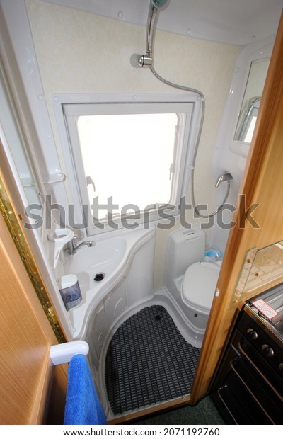 Devon\
England. Interior of a coach built motor caravan showing the shower\
room, swivel toilet and fixed corner sink.\
