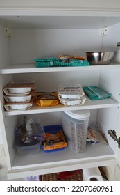 Devon England September 2022. View Inside A Domestic Kitchen Wall Cupboard Of Dog Food Including Meat, Biscuits And Treats.