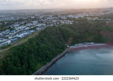 Devon, Southwest England. Oddicombe Beach Below Babbacombe, Torquay. Sunset, Dusk Creates A Moody Atmosphere In This Holiday Tourist Hotspot. 