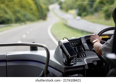 Devon, UK  July 6th 2022 Cabin Of A Passenger Coach With The Road Ahead Visible Out Of Focus. Interior Of A Bus Coach