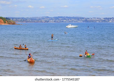 Devon, UK-July 12, 2020: People Enjoying In Water Sports On The Broadsands Beach