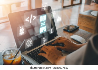 DevOps concept, Woman hand using laptop computer with DevOps icon on VR screen on desk, Methodology development operations agil programming technology.concept. - Shutterstock ID 2183007869