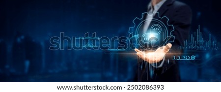 DEVOPS - Development and Operations. Businessman Holding Icon with Integration Solutions, Automation on Analysis Chart and Networking.