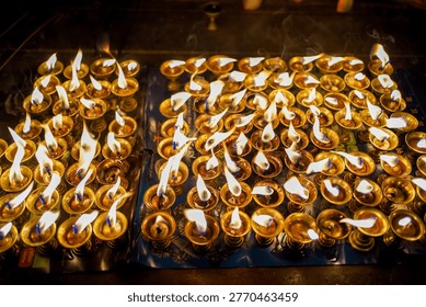 Devotees lights earthen lamp during the celebration of the Biska Sindur Jatra Festival in Thimi, Bhaktapur, Nepal.