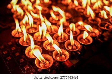 Devotees lights earthen lamp during the celebration of the Biska Sindur Jatra Festival in Thimi, Bhaktapur, Nepal.