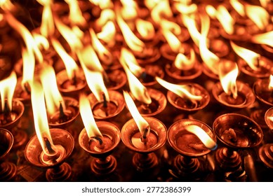 Devotees lights earthen lamp during the celebration of the Biska Sindur Jatra Festival in Thimi, Bhaktapur, Nepal.