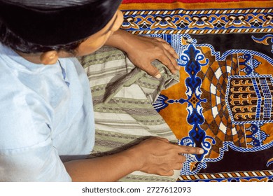 a devout man is performing the prayer
