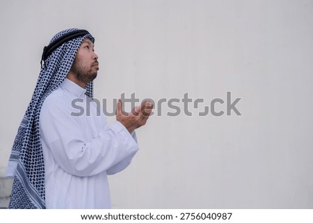 devout Muslim men making dua during outdoor prayer, hands raised in deep spiritual devotion and faith, demonstrating religious traditions and peaceful reflection in a serene setting.