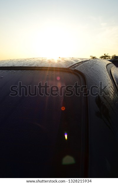 Dew and sun and\
car