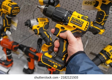 DeWalt Cordless Power Drill. A Man In A Hardware Store Chooses A New Drill Or Screwdriver. Screwdriver Tool In Hand Closeup. Minsk, Belarus, 2022