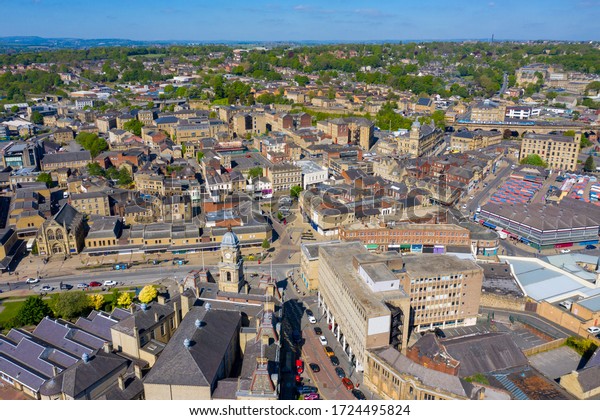 Dewsbury UK, 6th May 2020: Aerial photo of the town
centre of Dewsbury in West Yorkshire in the UK showing the
historical city centre, Dewsbury Town Hall, market stalls, shops on
a sunny summers day