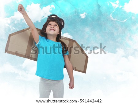 Dgital composite of smiling kid pretending to be a pilot against clouds