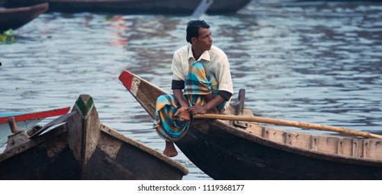 Dhaka, Bangladesh - 12 28 2008: A boatman sitting and waiting for his next client