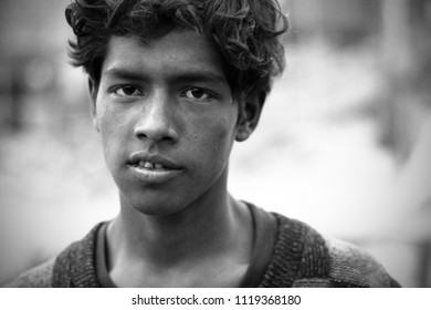 Dhaka, Bangladesh - 12 28 2008: Portrait of a poor labor boy at the ship terminal