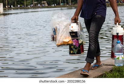 Dhaka, Bangladesh - 20 August 2021: A Street Vendor Selling Tea And Biscuits Inside Of Suhrawardy Udyan