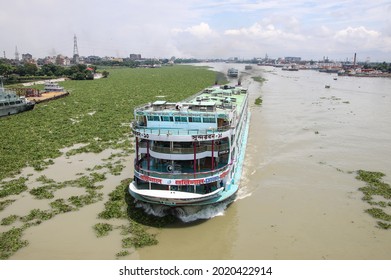 Dhaka, Bangladesh - 20th July 2021: Local Passenger ferry returning to Dhaka river port. Ferry is a very important means of communication with the southern part of Bangladesh