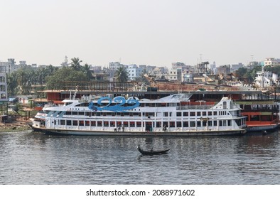 Dhaka, Bangladesh - 8th December 2021 : The Buriganga river flows next to Dhaka, the capital of Bangladesh. The dockyards along this river are very busy all year round