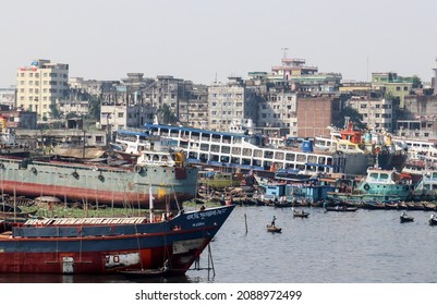 Dhaka, Bangladesh - 8th December 2021 : The Buriganga river flows next to Dhaka, the capital of Bangladesh. The dockyards along the river are busy with shipbuilding and repairing throughout the year
