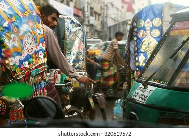 DHAKA, BANGLADESH - AUGUST 16, 2014: Chaotic And Dynamic Traffic Scene In Dhaka.