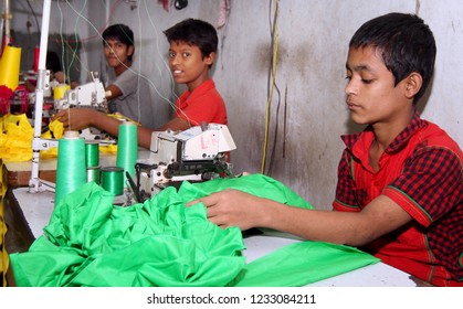 Dhaka, Bangladesh - December 08, 2014: Bangladeshi Childs Working In A Small Garment Factory At Keraniganj In Dhaka, Bangladesh On December 08, 2014.