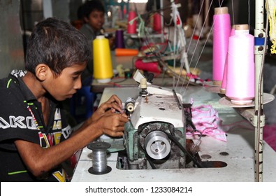 Dhaka, Bangladesh - December 08, 2014: Bangladeshi Childs Working In A Small Garment Factory At Keraniganj In Dhaka, Bangladesh On December 08, 2014.