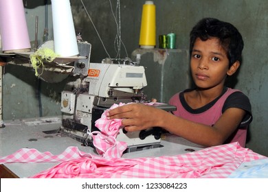 Dhaka, Bangladesh - December 08, 2014: Bangladeshi Childs Working In A Small Garment Factory At Keraniganj In Dhaka, Bangladesh On December 08, 2014.