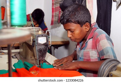 Dhaka, Bangladesh - December 08, 2014: Bangladeshi Childs Working In A Small Garment Factory At Keraniganj In Dhaka, Bangladesh On December 08, 2014.