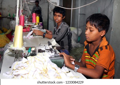 Dhaka, Bangladesh - December 08, 2014: Bangladeshi Childs Working In A Small Garment Factory At Keraniganj In Dhaka, Bangladesh On December 08, 2014.