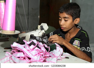 Dhaka, Bangladesh - December 08, 2014: Bangladeshi Childs Working In A Small Garment Factory At Keraniganj In Dhaka, Bangladesh On December 08, 2014.