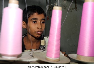 Dhaka, Bangladesh - December 08, 2014: Bangladeshi Childs Working In A Small Garment Factory At Keraniganj In Dhaka, Bangladesh On December 08, 2014.