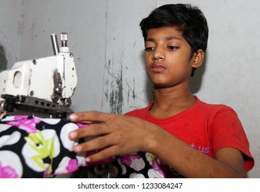 Dhaka, Bangladesh - December 08, 2014: Bangladeshi Childs Working In A Small Garment Factory At Keraniganj In Dhaka, Bangladesh On December 08, 2014.