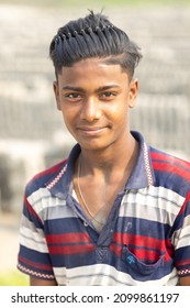 DHAKA, BANGLADESH - DECEMBER 27, 2021: A Young Underaged Kid Is Doing Child Labour At The Brick Kilns, The Stone And Brick Factory 